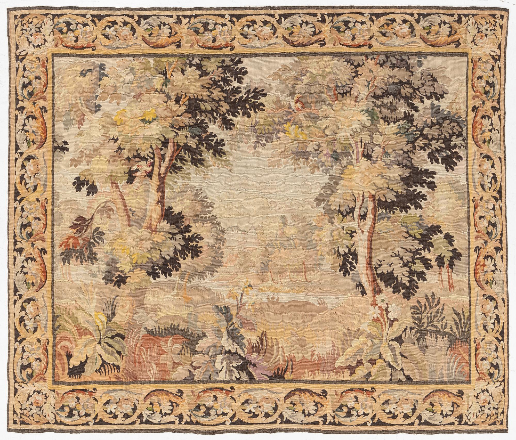 A European 'verdur' tapestry, c. 297 x 290 cm, 17th century.