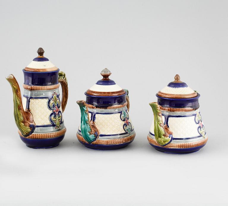 A majolica coffee pot and two tea pots from Gustavsberg, turn of the century 1900.