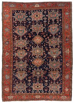 373. An antique Heriz carpet of karadja design, Northwest Persia (Iran), c. 338 x 239 cm.