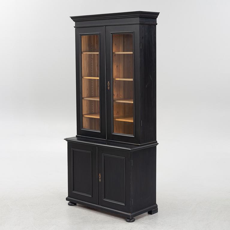 A cabinet, around the year 1900.