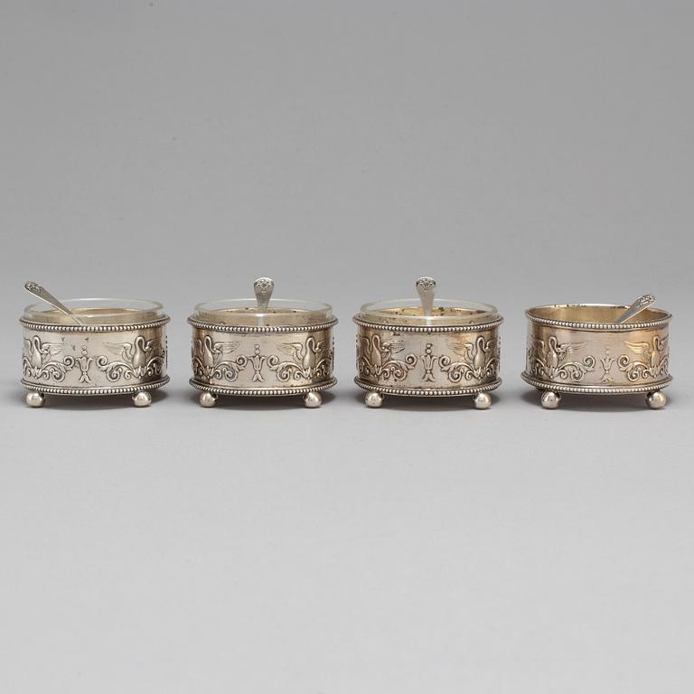 A set of four Fabergé salt-cellars and spoons, marked Moscow 1908-1917. Imperial Warrant.