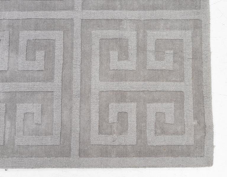 A 'Cubes' carpet, Layered, c. 270 x 180 cm.