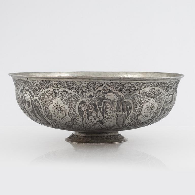 A west Asian repoussé silver and copper vessle, circa 1900.