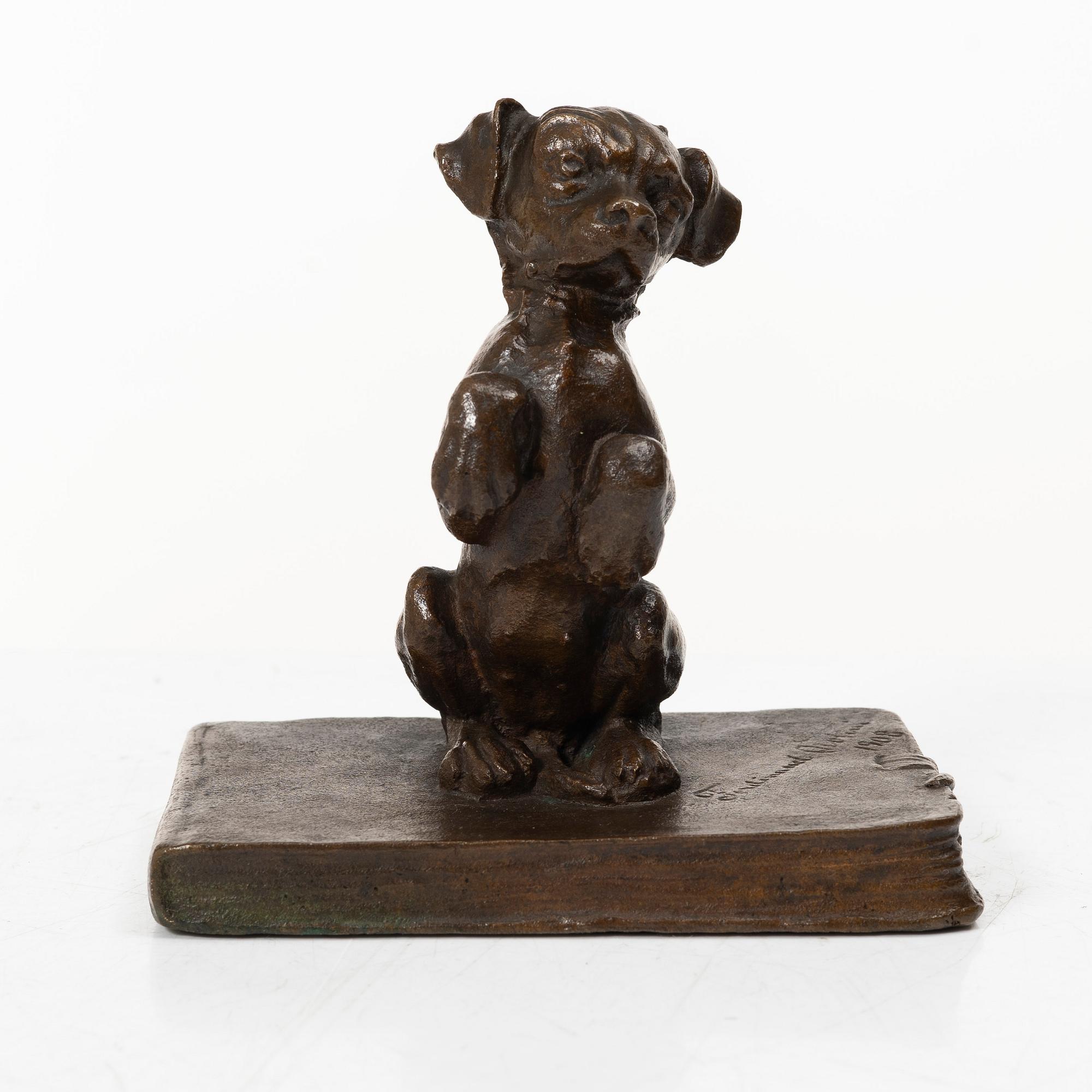 Ferdinand Notini, a bronze sculpture/paper weight, signed, 1908.