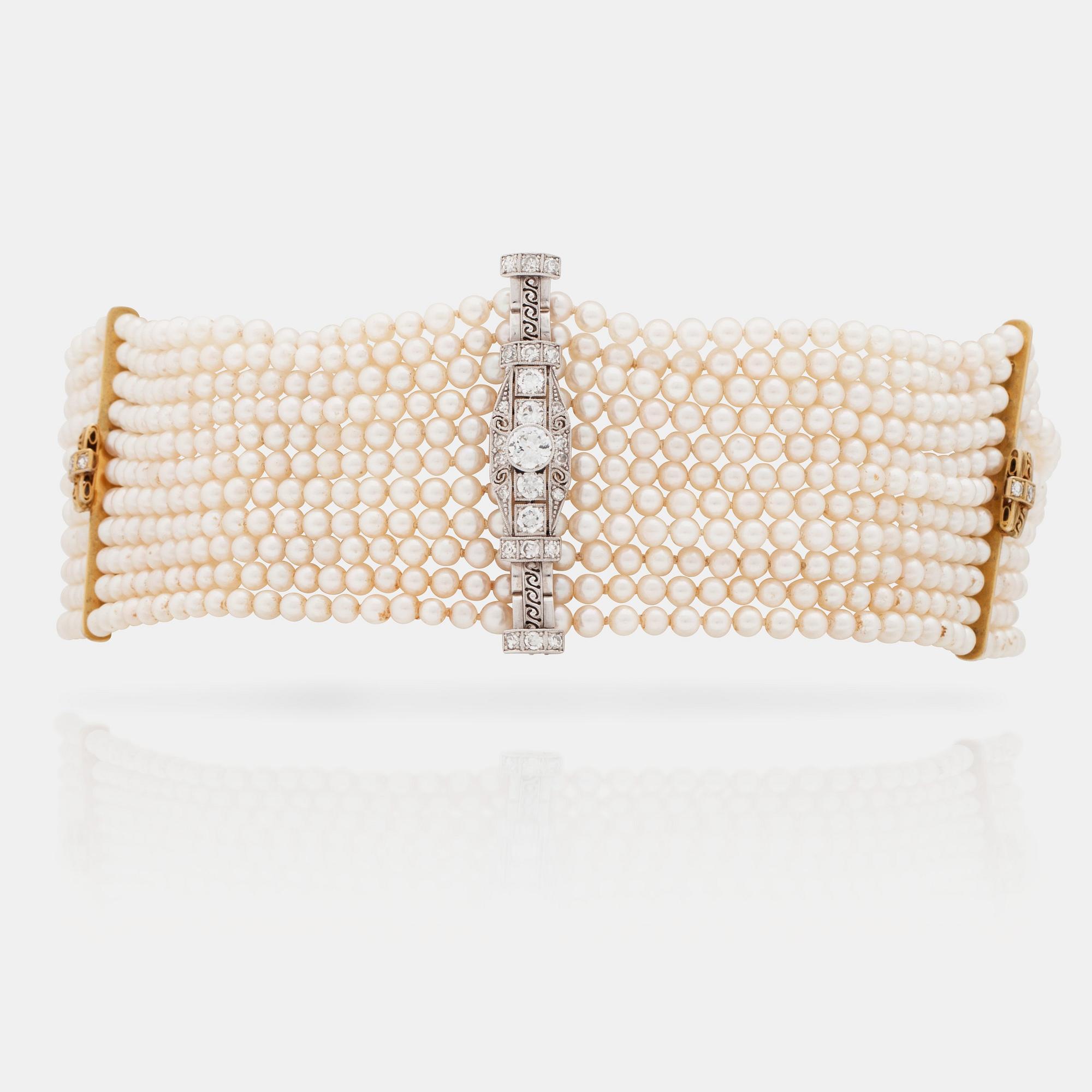 A cultured saltwater pearl and diamond choker necklace. Total carat weight 1.00 ct.