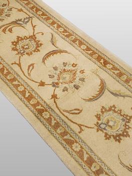 A runner carpet, Tabriz, 398 x 81 cm.