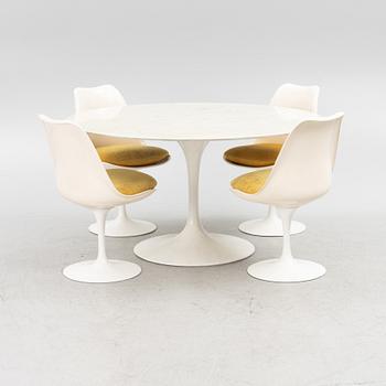 Eero Saarinen, a "Tulip" dining table with four chairs, 1970's.