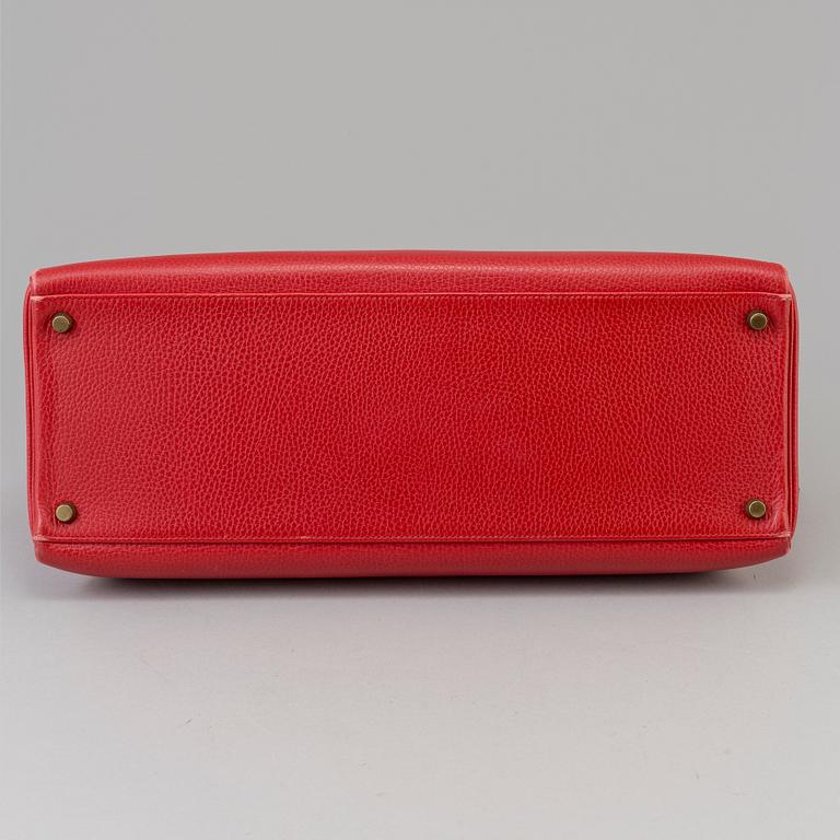 A red Epson "Kelly 40" bag by Hermès 1991.