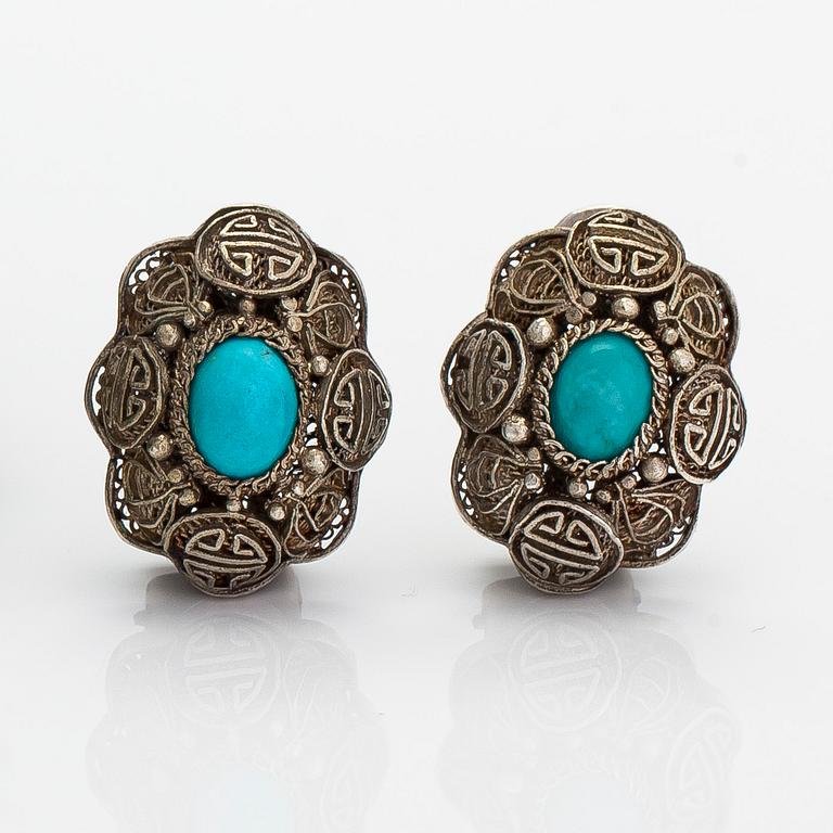 A bracelet and pair of earrings in silver with turquoises. Import marked Risto Aho, Helsinki 1964.