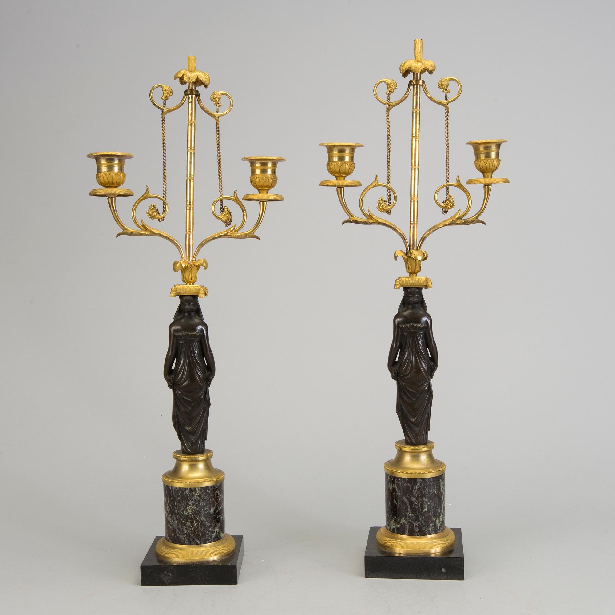 A pair of 1800s empire candelabras.