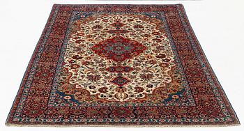 A rug, semi-antique, Teheran, part silk, 204 x 132 cm.