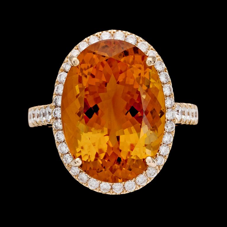 A citrine and brilliant cut diamond ring.
