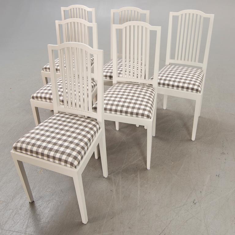 A set of six painted chairs around 1900.
