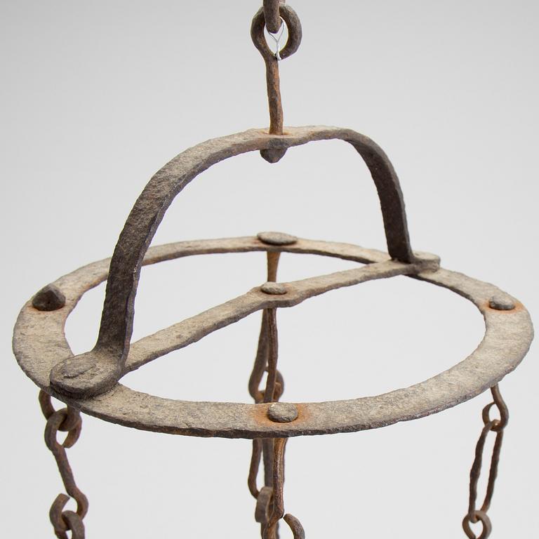 A wrought iron meat hanger 18/19th century.