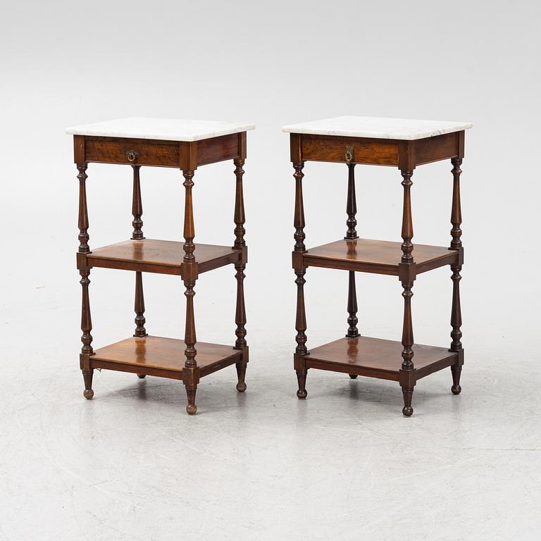 A pair of bedside tables with marble tops, from around the year 1900.