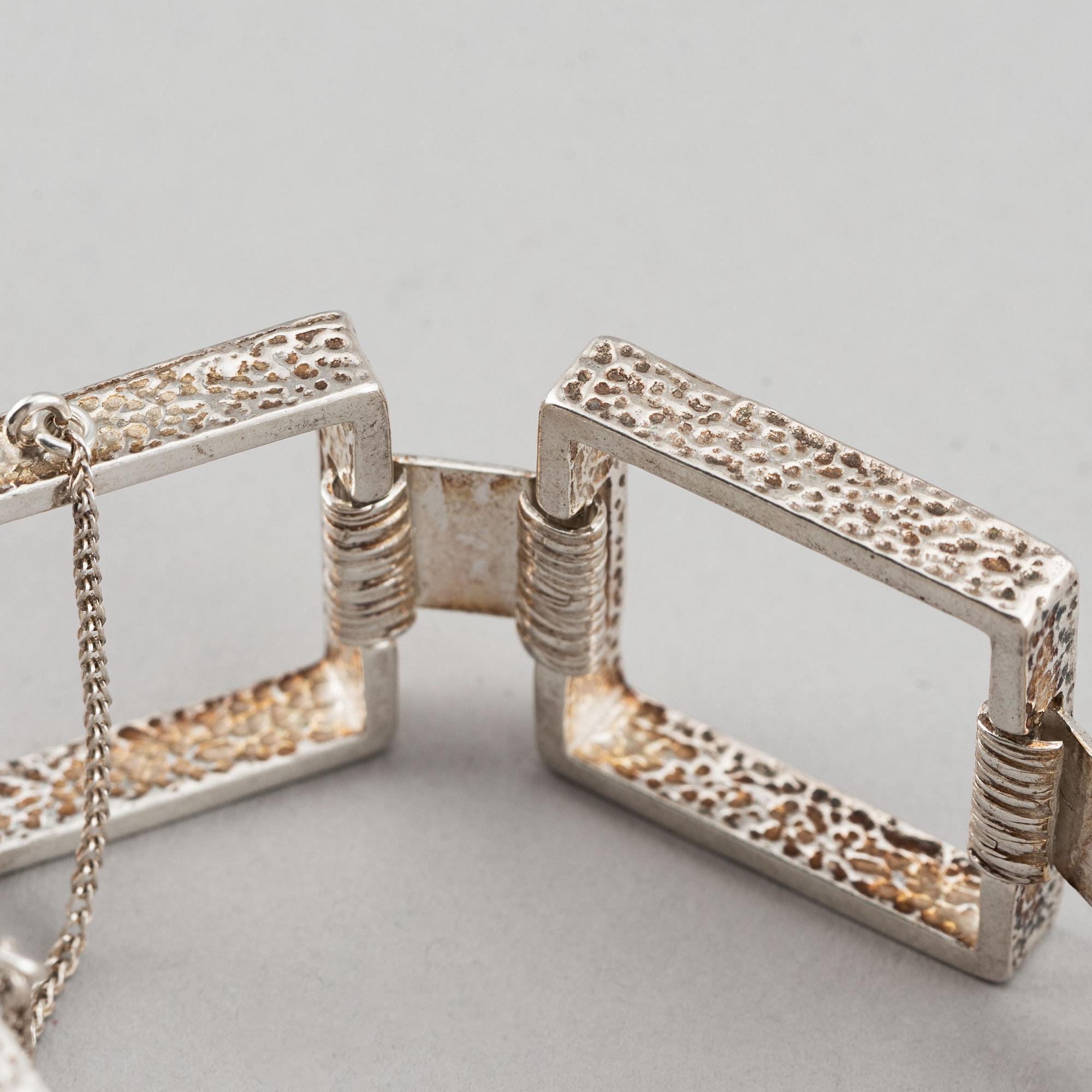 Two silver bracelets, including Denmark.