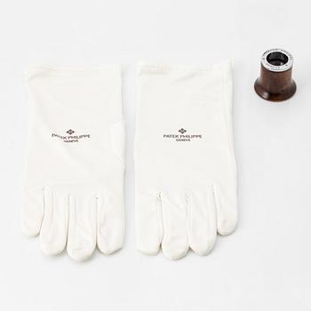 Patek Philippe, loupe, gloves.