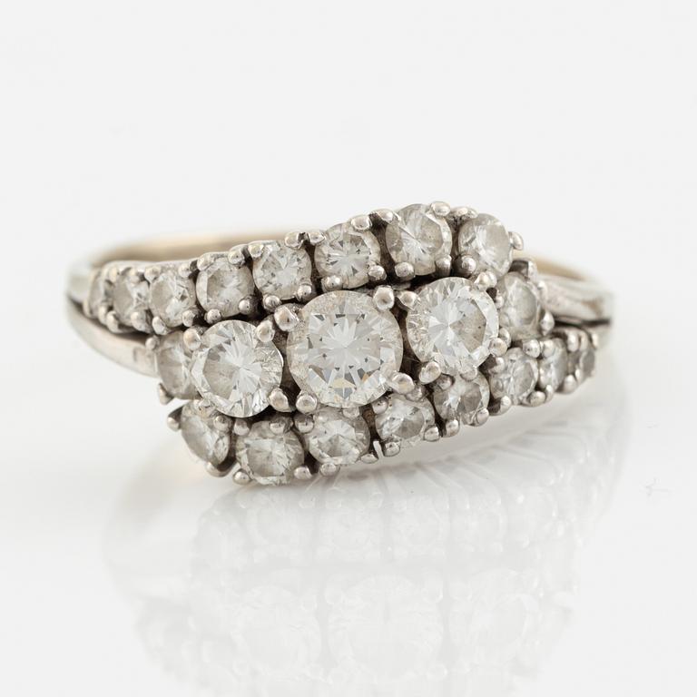 14K white gold and brilliant cut diamond ring.