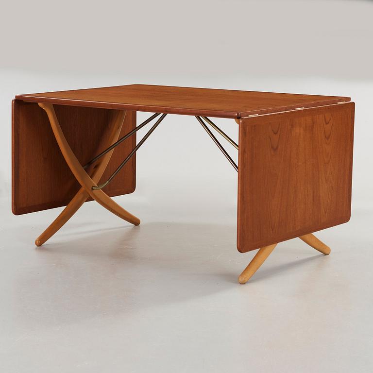 Hans J. Wegner, a teak and beech dining table by Andreas Tuck, Denmark 1950-60's.