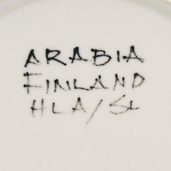 Hilkka-Liisa Ahola, a ceramic serving dish and ten side plates, signed HLA, Arabia Finland.