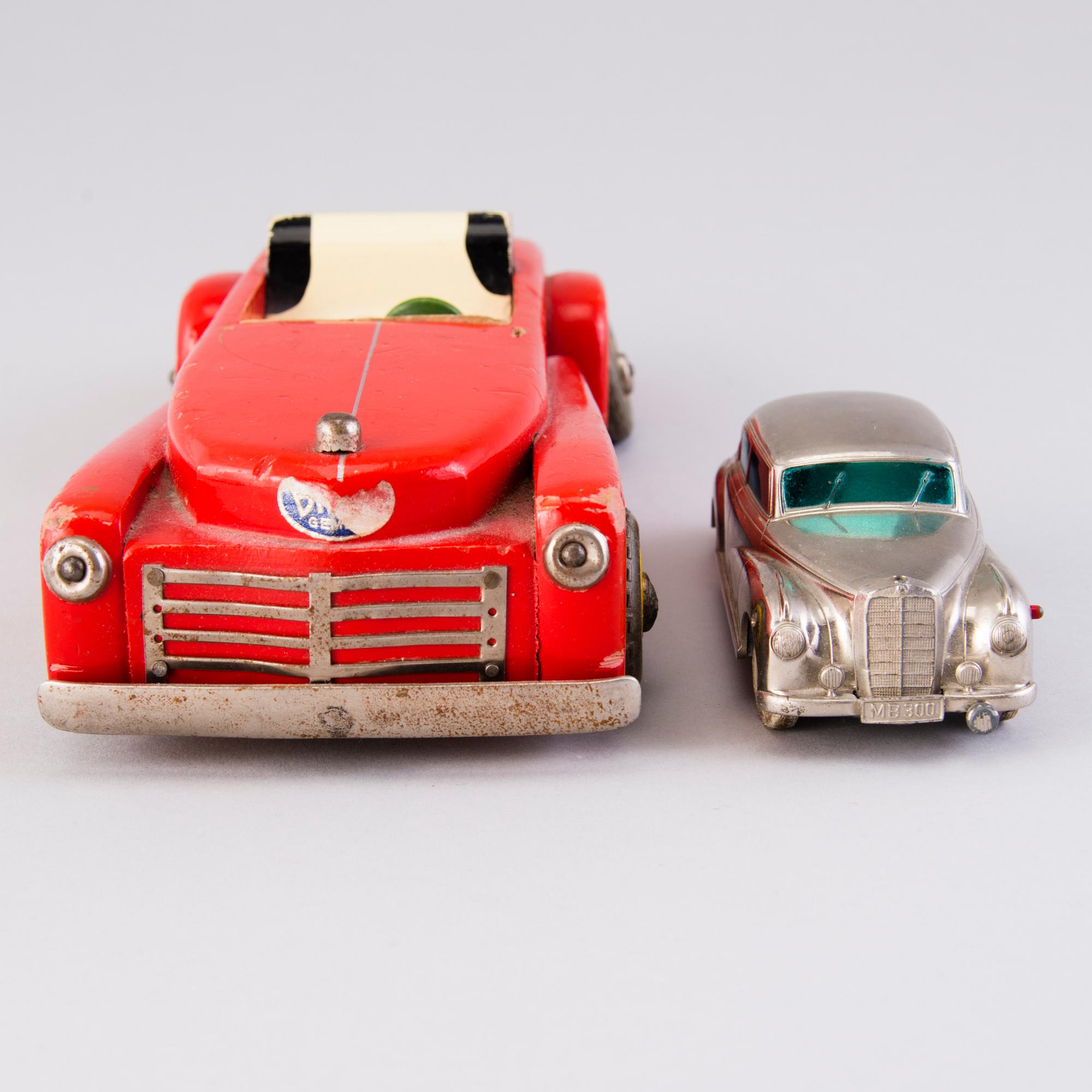 Two mid-20th century toy cars, chromed metal and wood.