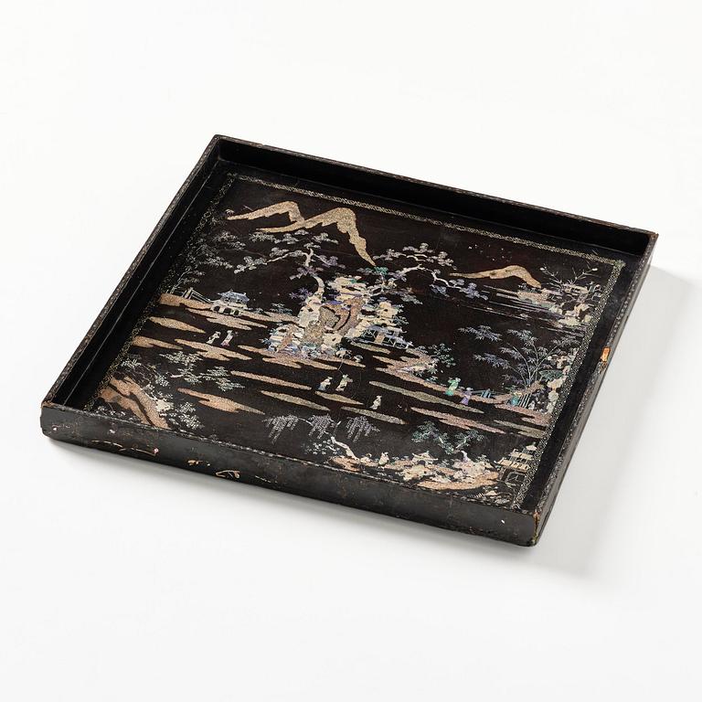A black lacquer and mother of pearl tray, Qing dynasty, 18th century.