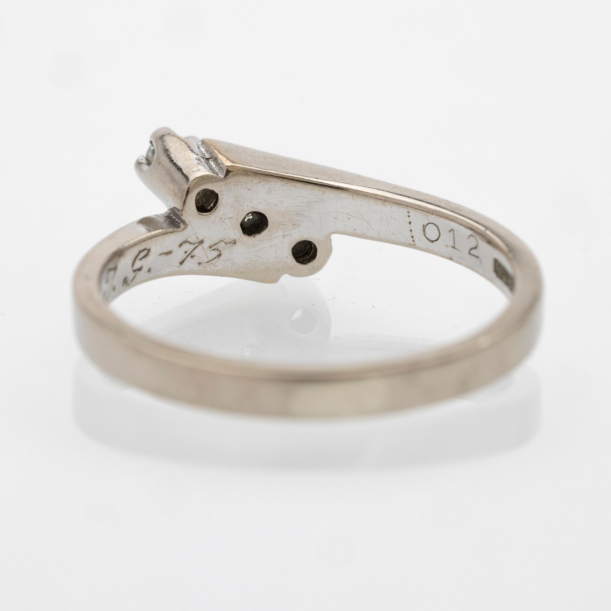 18K white gold ring with diamonds.