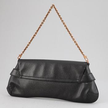 GUCCI, a black leather handbag.