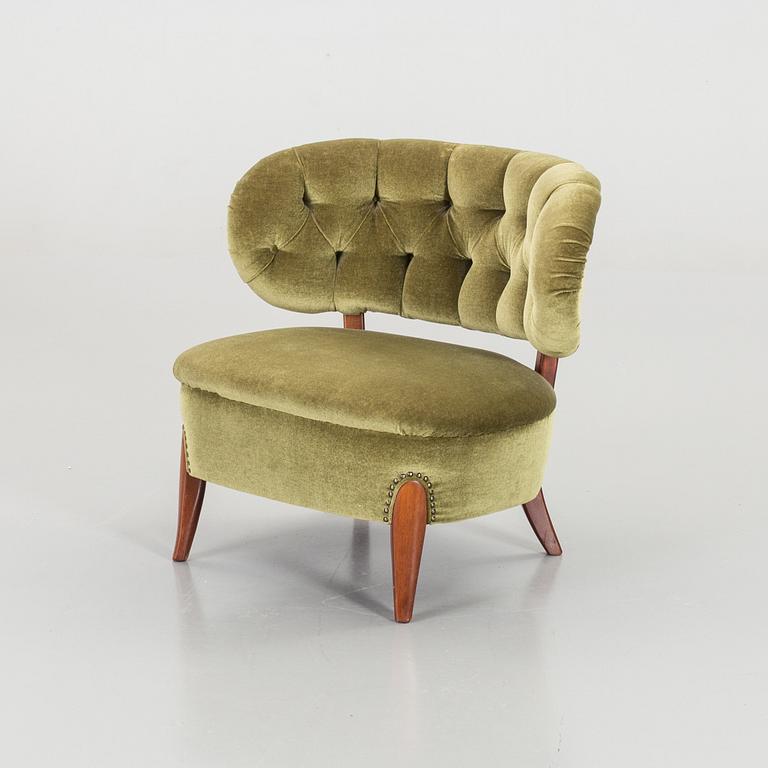 AN OTTO SCHULTZ LOUNGE CHAIR.