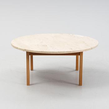 An oak coffee table with a later travertine top.