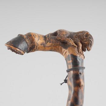 A carved wooden cane, 19th century.