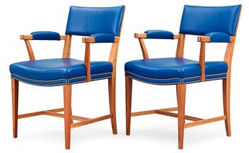 A pair of Josef Frank mahogany and blue leather armchairs, Svenskt Tenn, model 695.