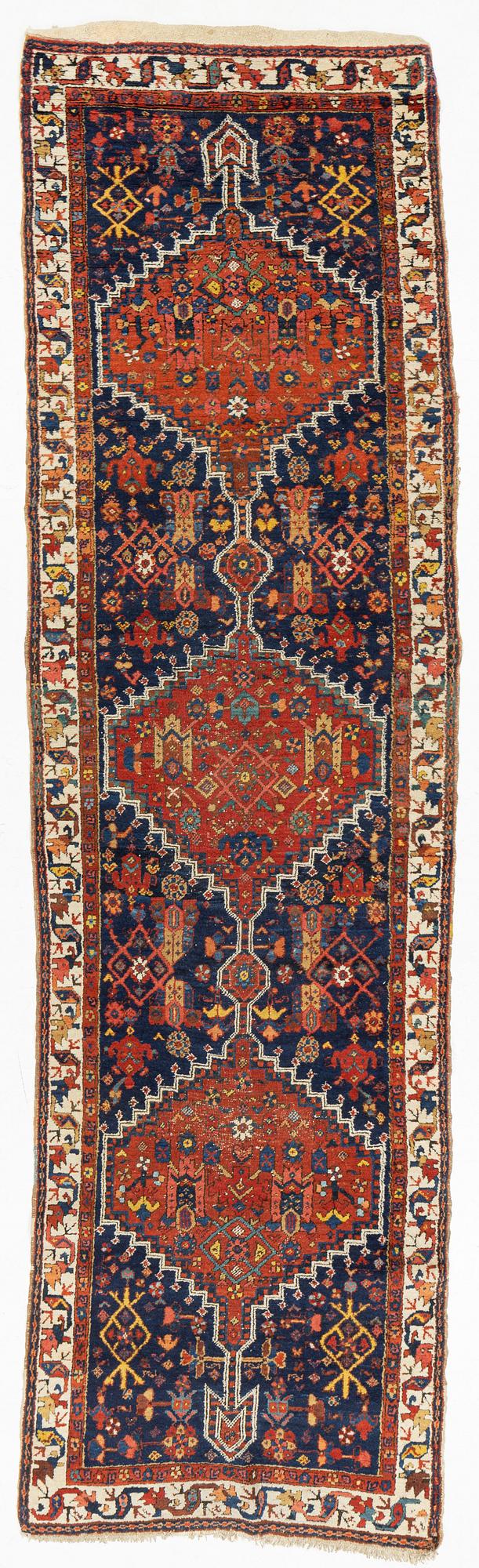 An antique runner, probably Karadja, circa 360 x 98 cm.
