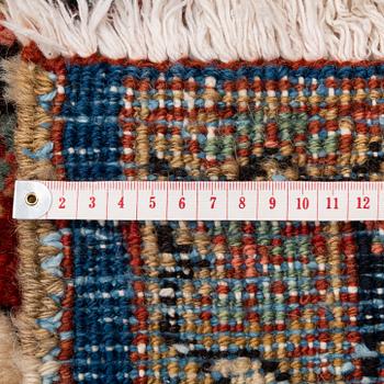 A semi-antique Heris carpet, c. 364 x 299 cm.