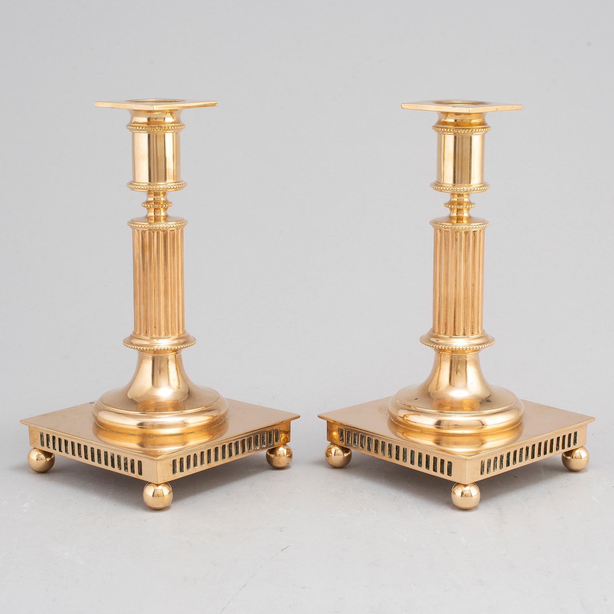 A pair of model 38 brass candlesticks from Gusums Bruk, first half of the 20th century.
