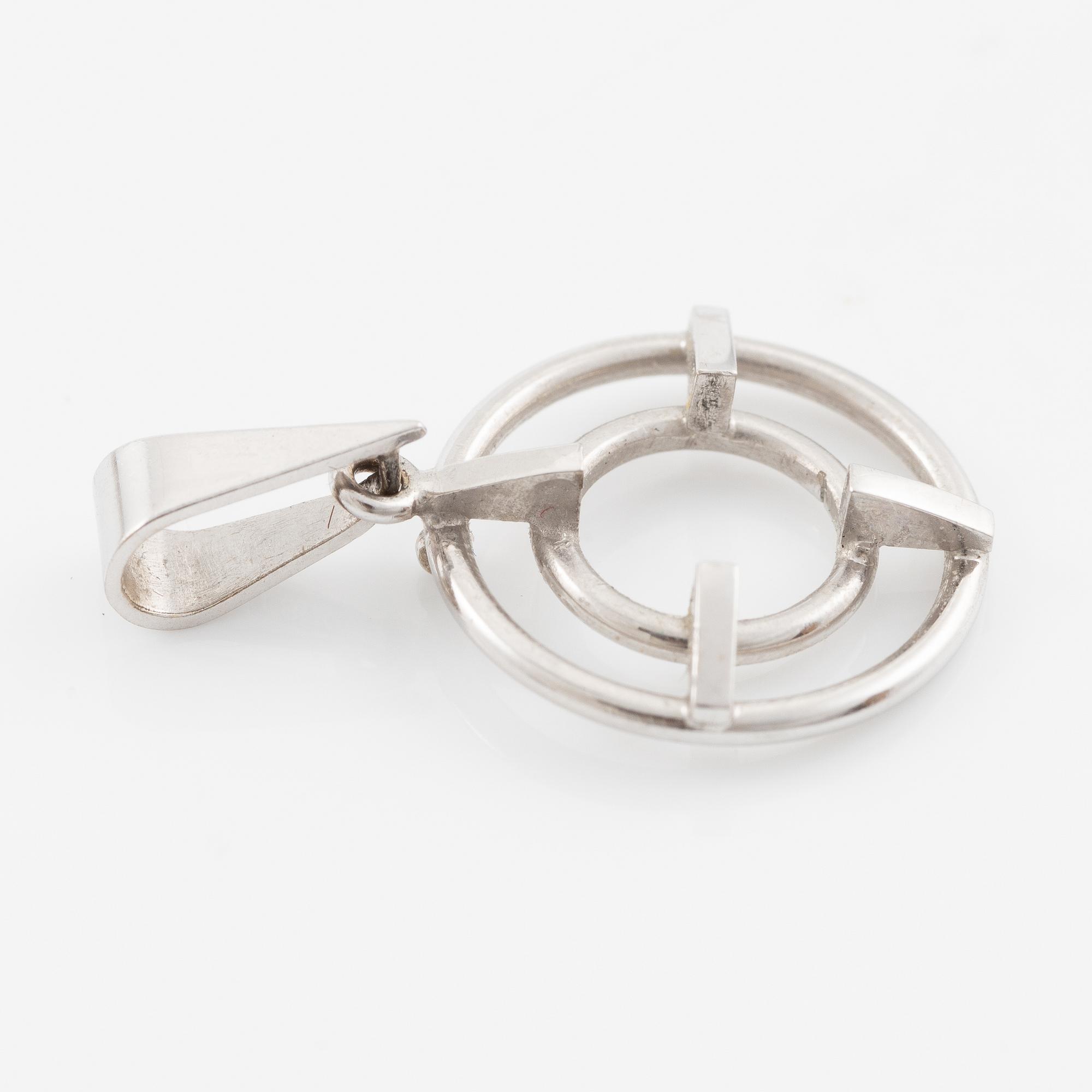 Brooch/pendant, 18K white gold with sapphire and brilliant-cut diamonds.