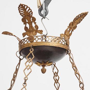 A presumably Russian Empire gilt and patinated bronze nine-branch chandelier, 19th century.