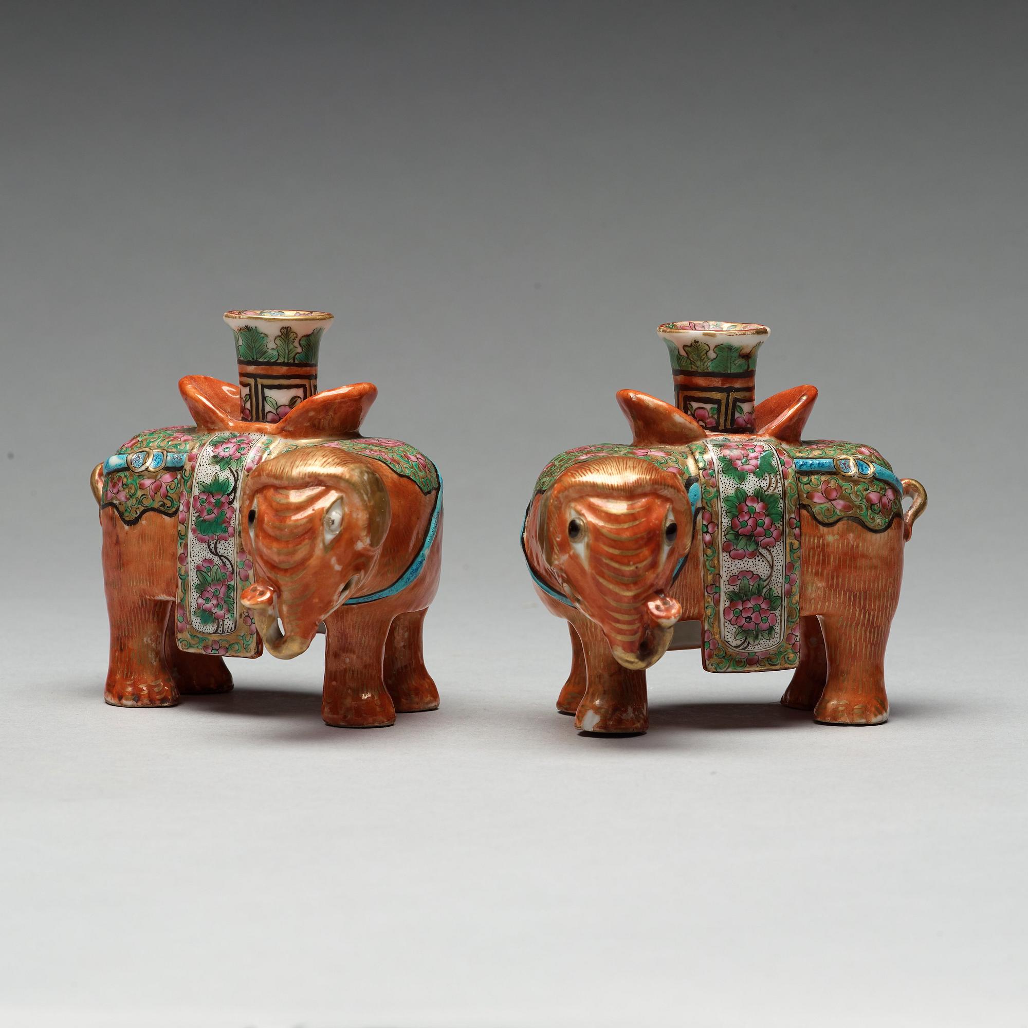 A pair of Canton candle sticks in the shape of elephants, Qing dynasty, 19th century.