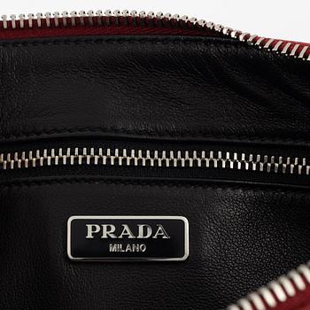 Prada, A patterned saffiano clutch.