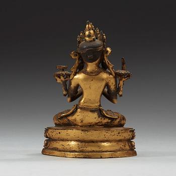 A gilt copper alloy figure of Manjushri, Nepal 15th/16th Century.