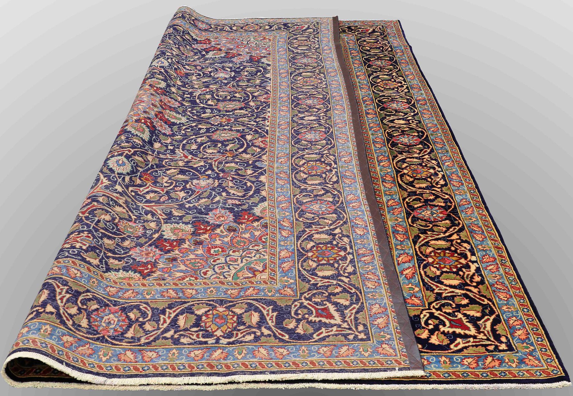 A carpet, Kashmar, signed, ca 390 x 295 cm.