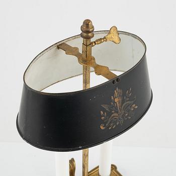 A gilt brass candlestick, 20th Century with older parts.