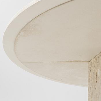 A travertine  'Epic Dining Table' from Gubi.