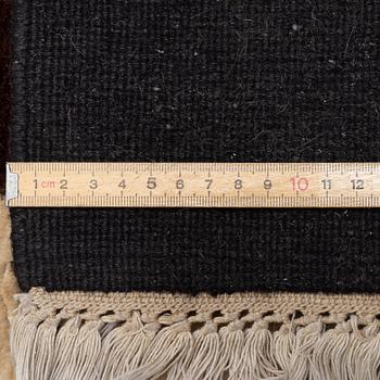 A carpet, c. 460 x 370 cm.