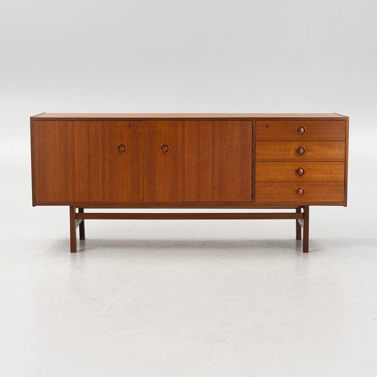 A 1960's teak-veneered sideboard.
