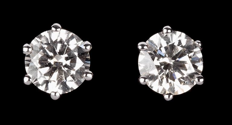 A pair of diamond studs, 1.02 /1.03 cts.