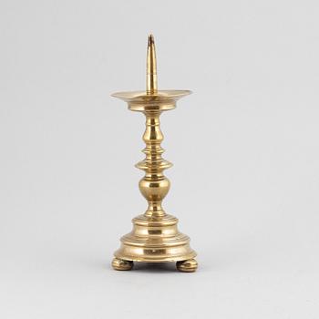 A 16th century bronze candlestick.