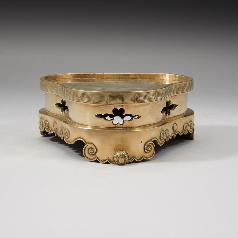 A polished copper alloy stand, Qing dynasty, 18/19th Century.