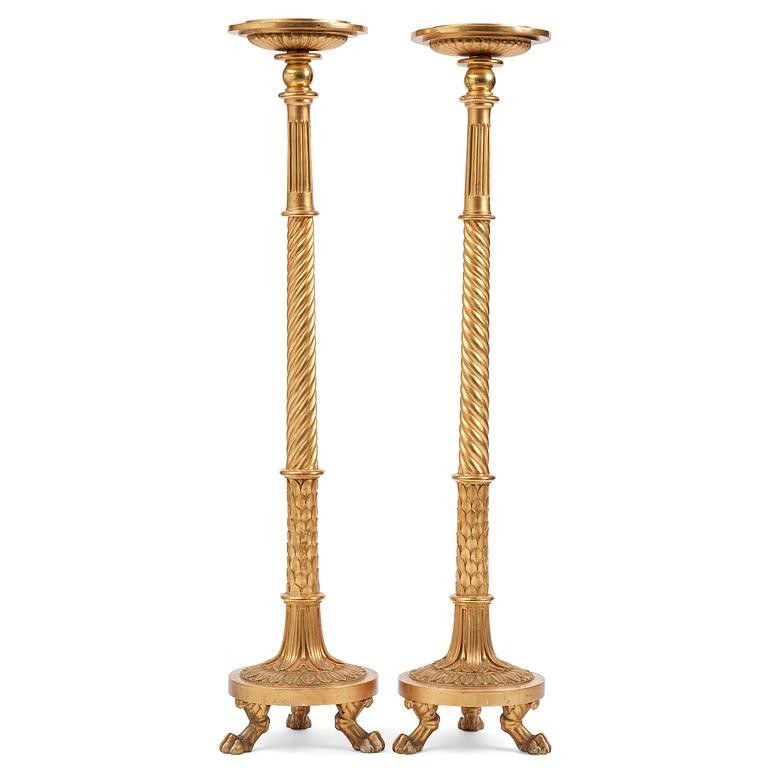 A pair of late Gustavian giltwood torchères by J. Frisk (master in Stockholm 1805-24).