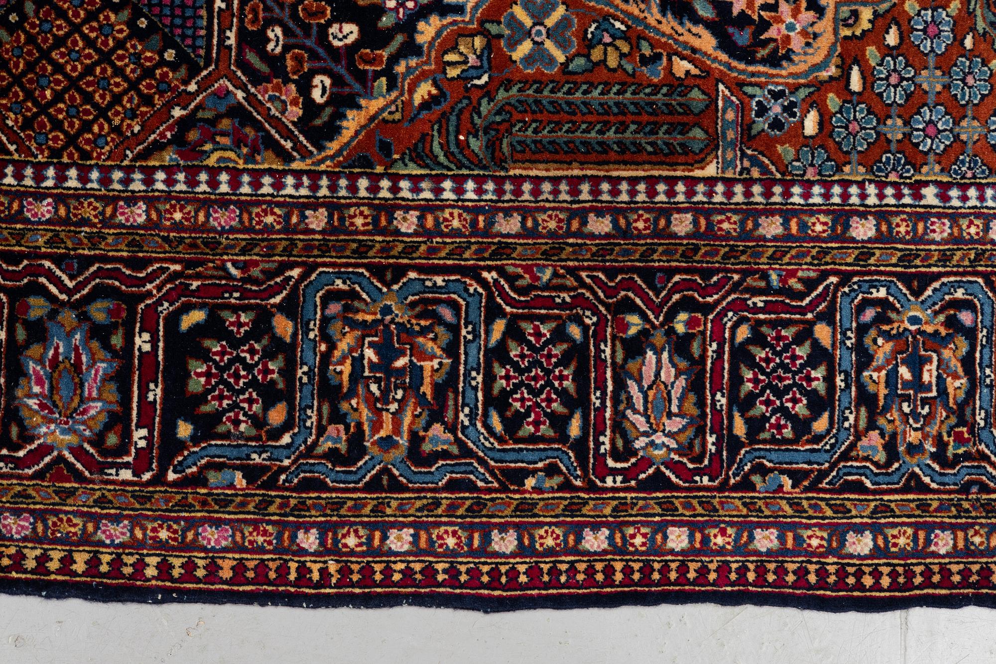 A rug, semi-antique Kashan, ca 216,5 x 140 cm.